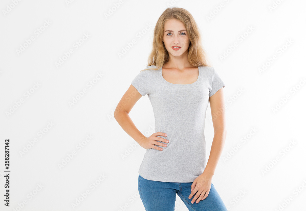 Young blonde woman with fit slim body in blank template t shirt and jeans isolated on white background. Skin and hair care. Copy space and mock up Young blonde woman with fit slim body in blank template t shirt and jeans isolated on white background. Skin and hair care. Copy space and mock up