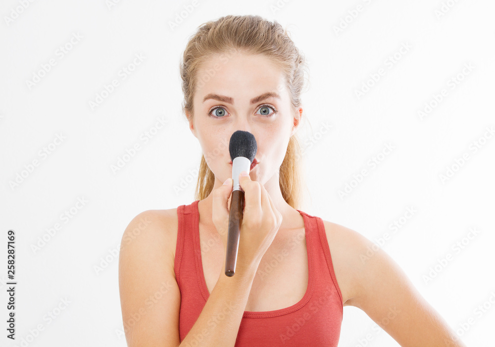 Closeup of happy young woman face with make up brush isolated on white background. Beauty girl skin care concept. Copy space Closeup of happy young woman face with make up brush isolated on white background. Beauty girl skin care concept. Copy space