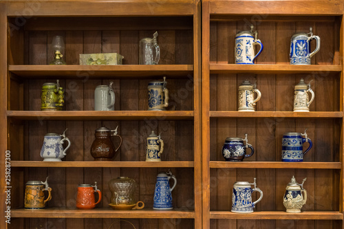 old tea pot in the brown wood shelf