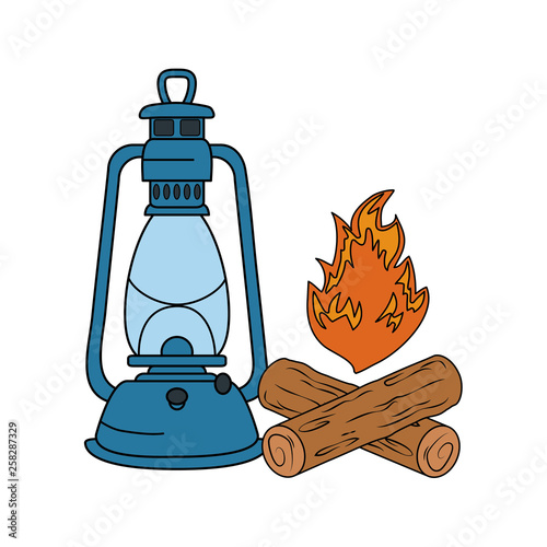 campfire camping and kerosene lantern