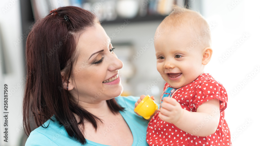 Portrait of happy mother with her cute baby girl Portrait of happy mother with her cute baby girl