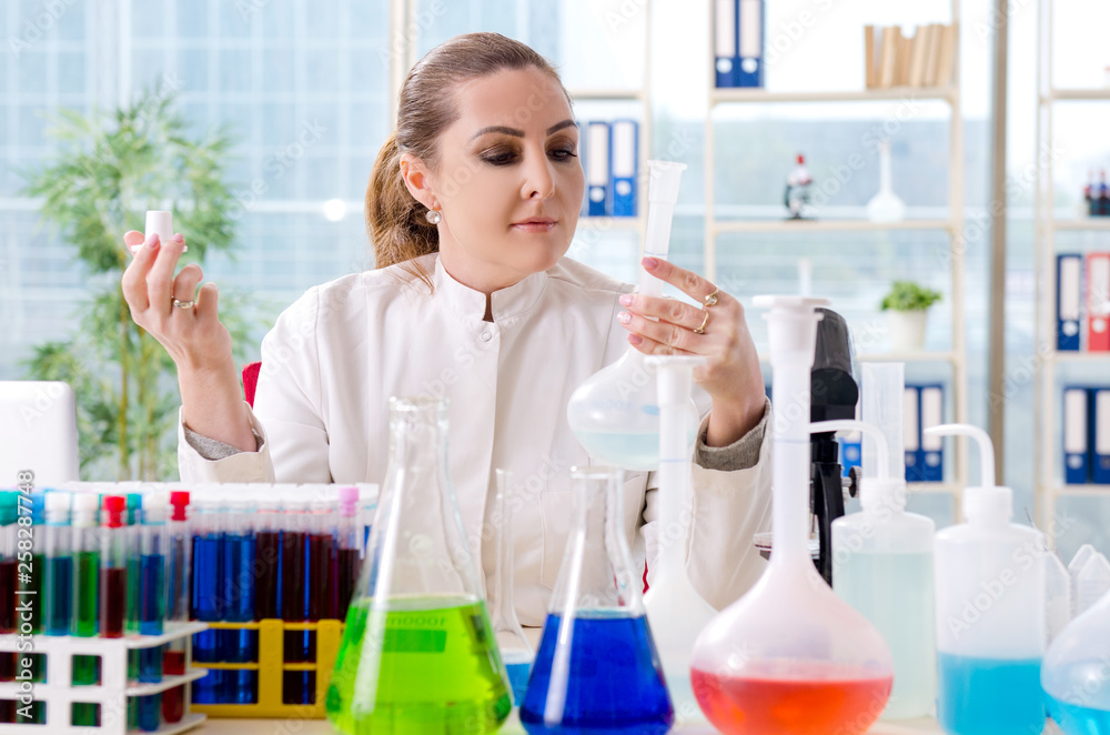 Female chemist working in medical lab Female chemist working in medical lab