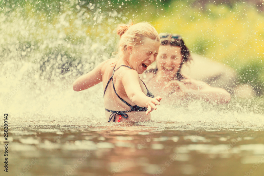 Women swimming and splashing in the water