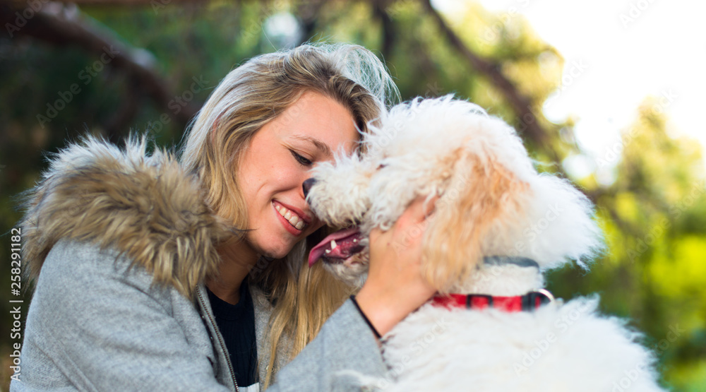 Young girl with her dog in a park