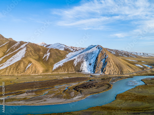 River and Snow Mountain Background on Bayanbrook Grassland  Xinjiang  China 