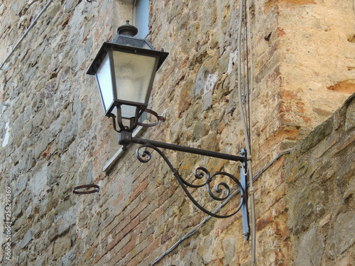 Ancient street lamp in the Medieval village of Civitella Benazzone  Umbria  Italy.