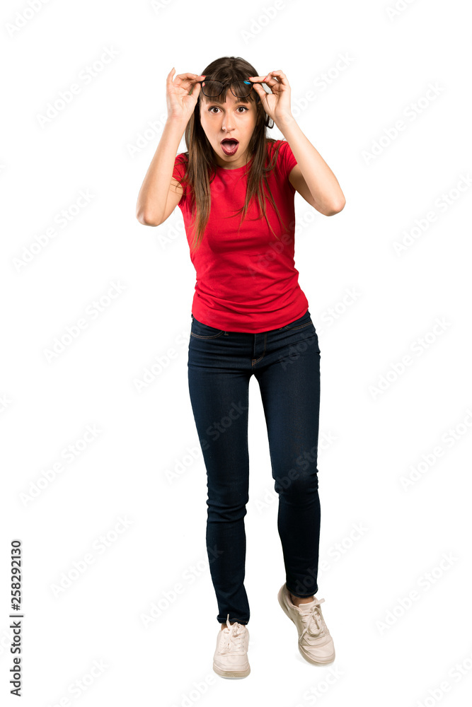 Full-length shot of Woman with glasses with glasses and surprised Full-length shot of Woman with glasses with glasses and surprised