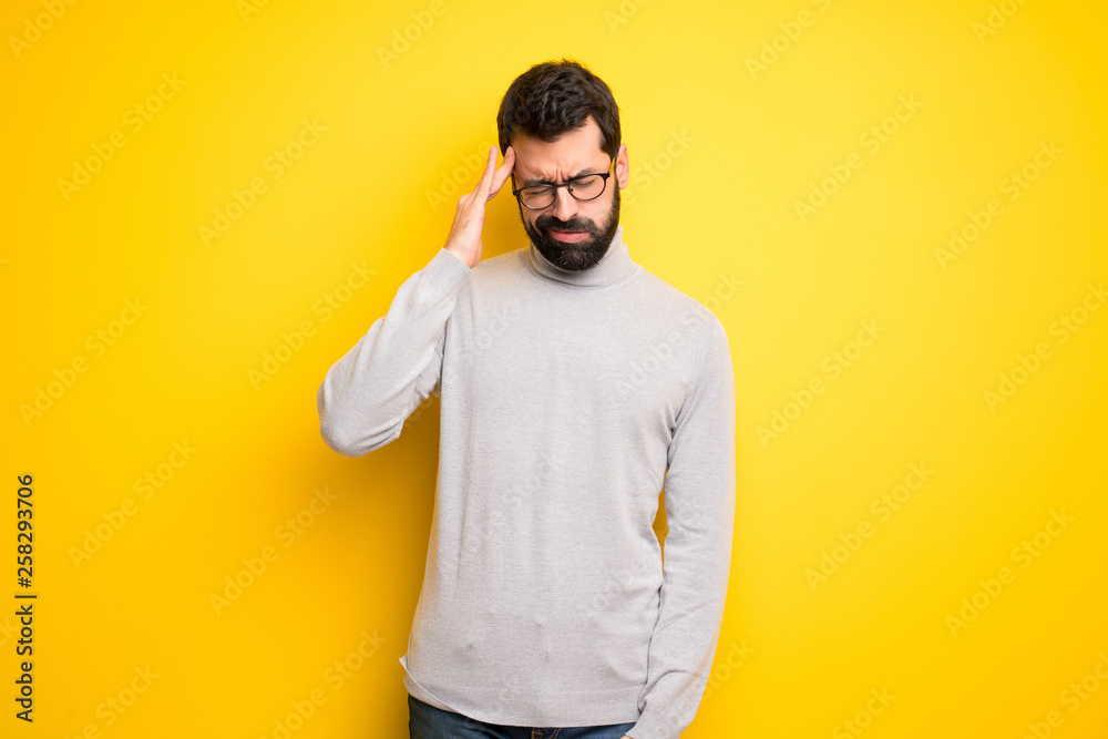 Man with beard and turtleneck unhappy and frustrated with something Man with beard and turtleneck unhappy and frustrated with something