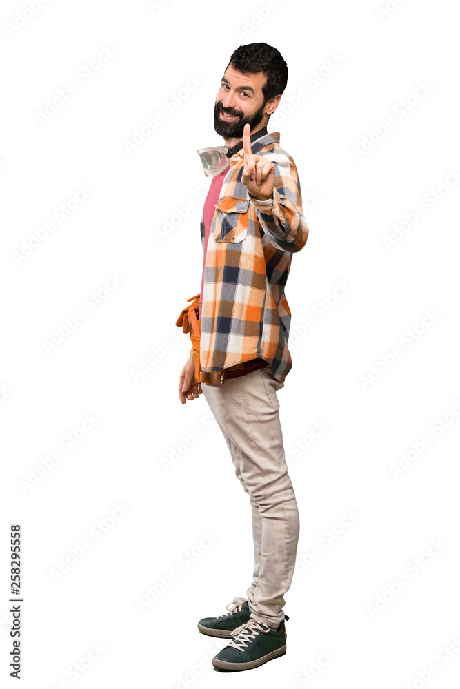 Craftsmen man showing and lifting a finger over isolated white background Craftsmen man showing and lifting a finger over isolated white background