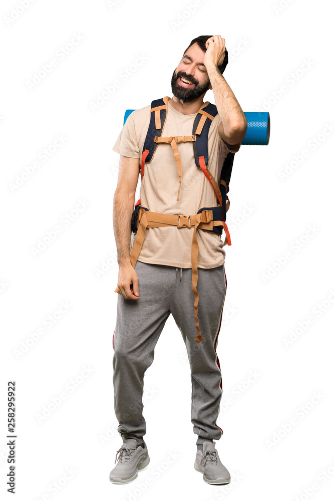 Hiker man has realized something and intending the solution over isolated white background Hiker man has realized something and intending the solution over isolated white background