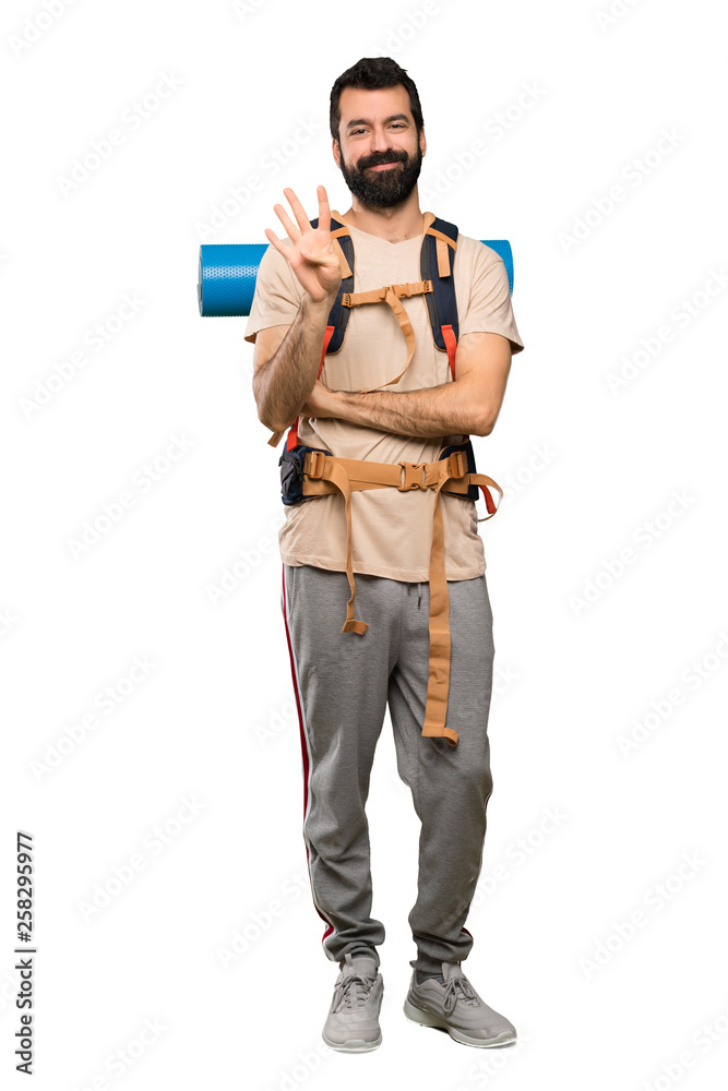 Hiker man happy and counting four with fingers over isolated white background Hiker man happy and counting four with fingers over isolated white background