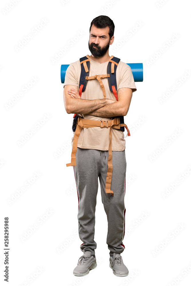Hiker man feeling upset over isolated white background Hiker man feeling upset over isolated white background