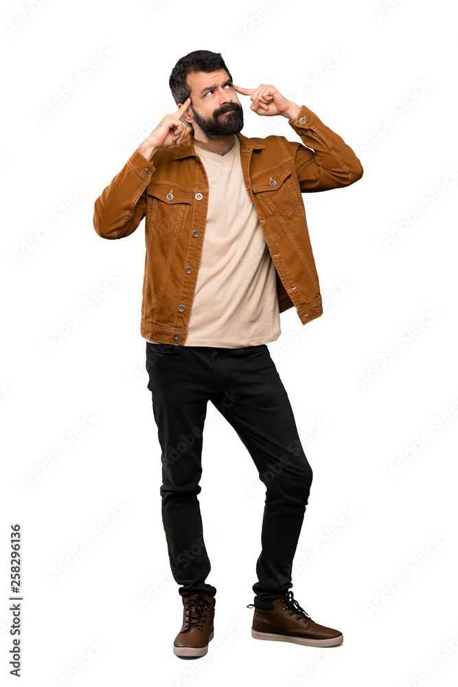 Handsome man with beard having doubts and thinking over isolated white background Handsome man with beard having doubts and thinking over isolated white background