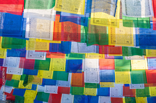 View of Tibetan flags in Thamel street in Kathmandu in the sunny weather. Multicolor flags. Prayer flags, Kathmandu, Nepal.
