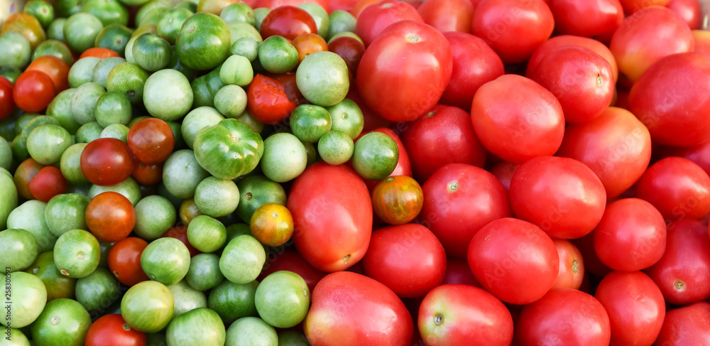 Red and green tomato texture background Red and green tomato texture background