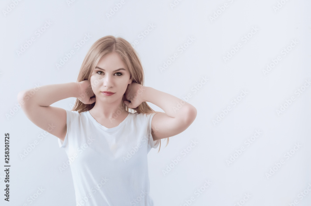 Attractive young girl holds hair with her hands Attractive young girl holds hair with her hands