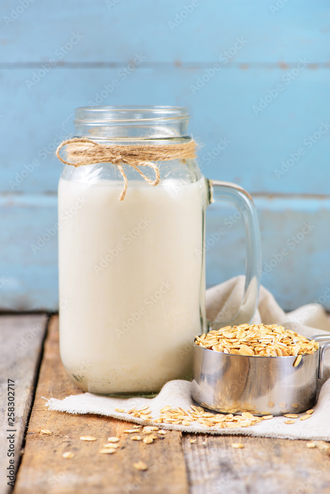 Vegan non dairy oat milk in a jar with copy space Vegan non dairy oat milk in a jar with copy space