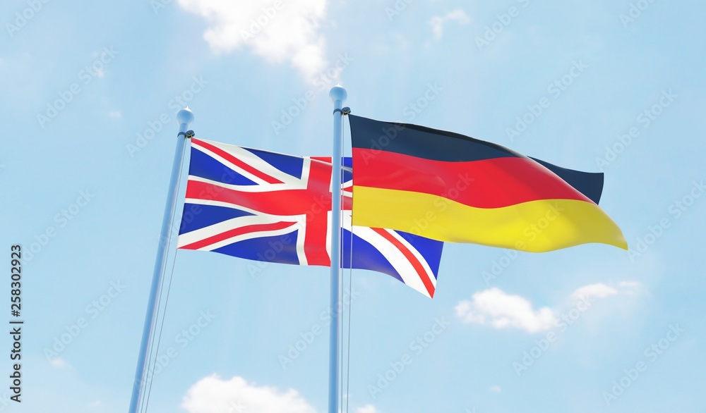 Germany and UK, two flags waving against blue sky. 3d image Germany and UK, two flags waving against blue sky. 3d image