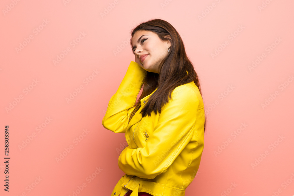 Teenager girl over pink wall thinking an idea Teenager girl over pink wall thinking an idea