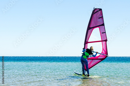 young girl windsurfer beginner learns to ride in the sea in Egypt Dahab South Sinai © Sofiia