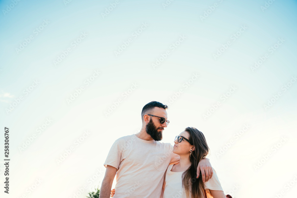 Loving embracing coulpe having fun in the spring nature Loving embracing coulpe having fun in the spring nature