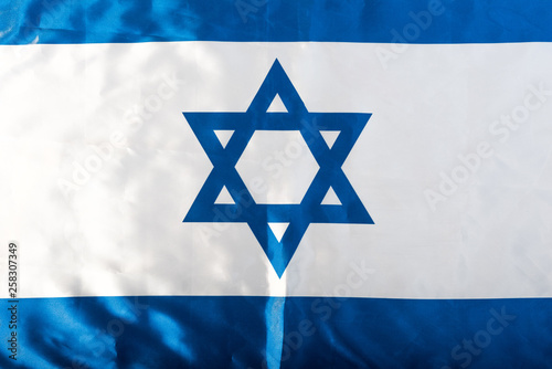 close up of national israel flag with blue star of david