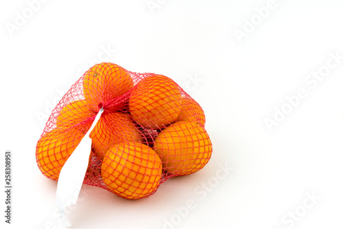 Oranges are Packed in a grid. White tag on the grid