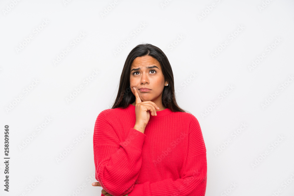 Young Colombian girl with glasses thinking an idea Young Colombian girl with glasses thinking an idea