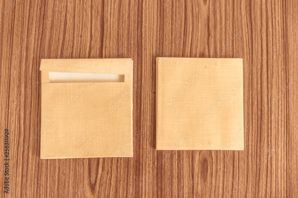 Set of two Brown envelope front and back isolated on wooden table hardwood floor background. Business cards blank. Mockup. Top high angel view object with clipping path. Flat Lay. Copy space for text Set of two Brown envelope front and back isolated on wooden table hardwood floor background. Business cards blank. Mockup. Top high angel view object with clipping path. Flat Lay. Copy space for text