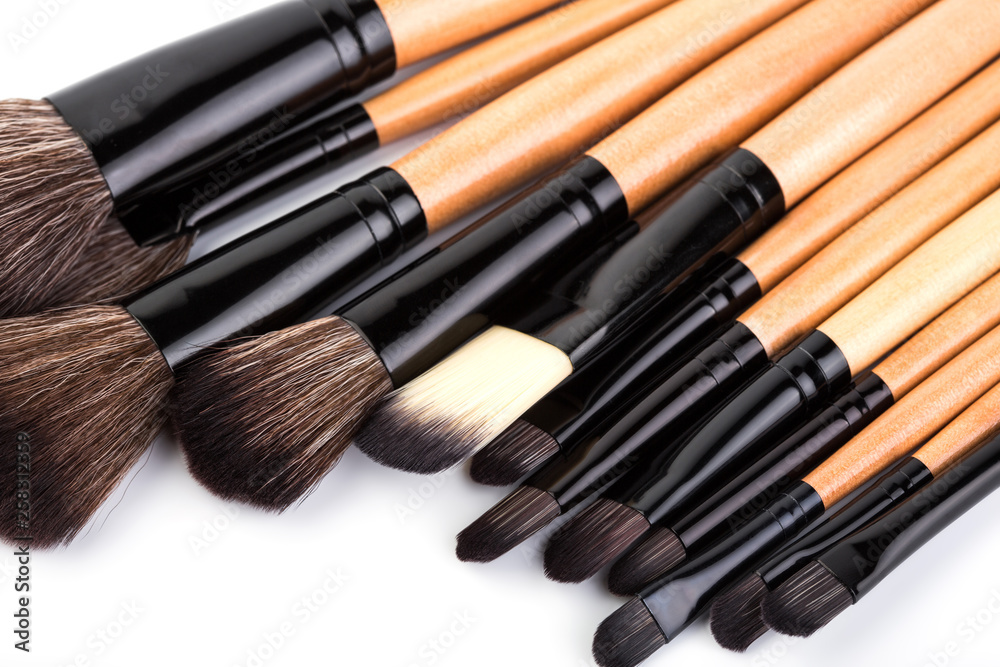 Various makeup brushes isolated over white. wooden makeup brushes. Duo fibre foundation makeup brush. Style. Fashion. Visage. Cosmetics. Various makeup brushes isolated over white. wooden makeup brushes. Duo fibre foundation makeup brush. Style. Fashion. Visage. Cosmetics.