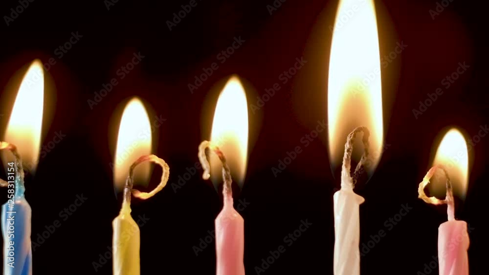 Collection set of birthday candles on black background, anniversary celebration concept, real time shot of burning and wax melting, horizontal pan shot Full hd 1080p Collection set of birthday candles on black background, anniversary celebration concept, real time shot of burning and wax melting, horizontal pan shot Full hd 1080p