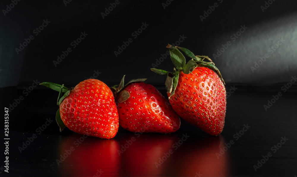 fresh strawberries. black background. crop 2019. one or more. Healthy food. Healthy lifestyle fresh strawberries. black background. crop 2019. one or more. Healthy food. Healthy lifestyle