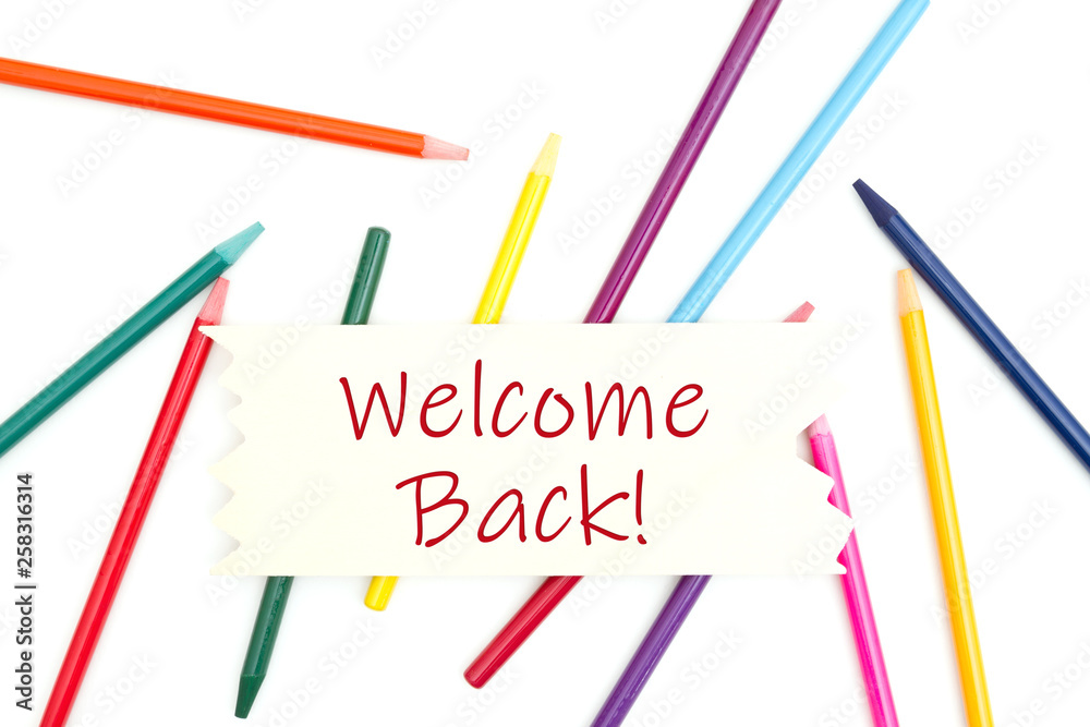 Welcome back message on wood sign with colored watercolor pencils Welcome back message on wood sign with colored watercolor pencils