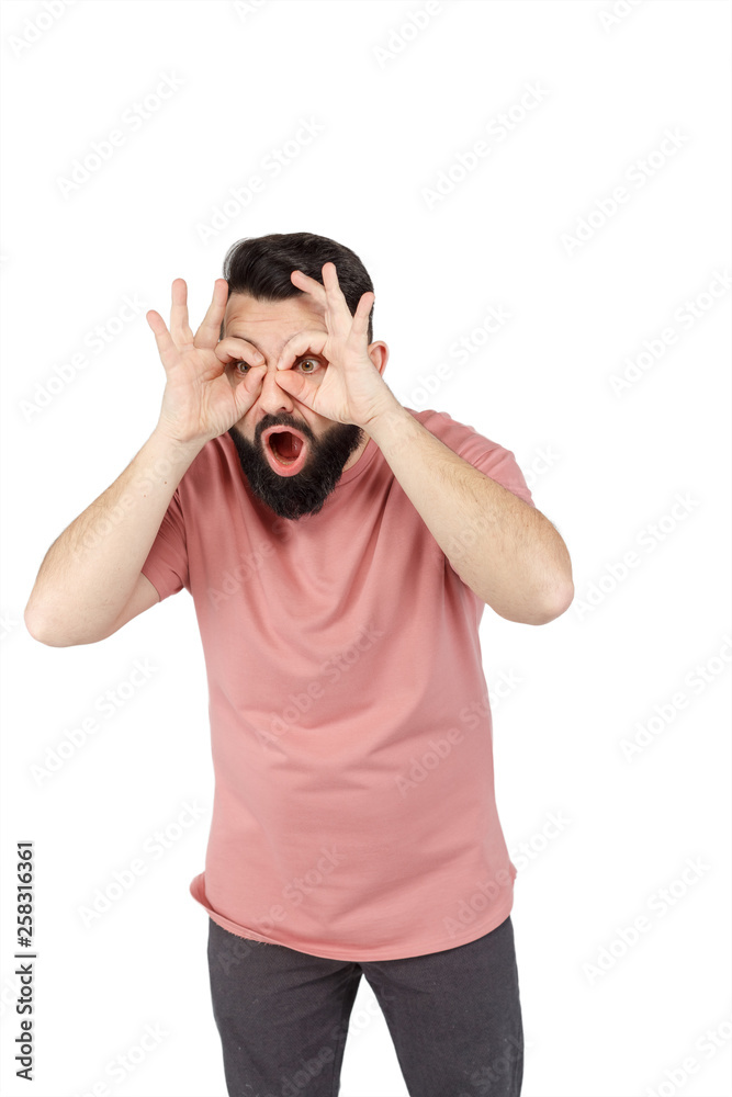 A cute young bearded man shows glasses A cute young bearded man shows glasses