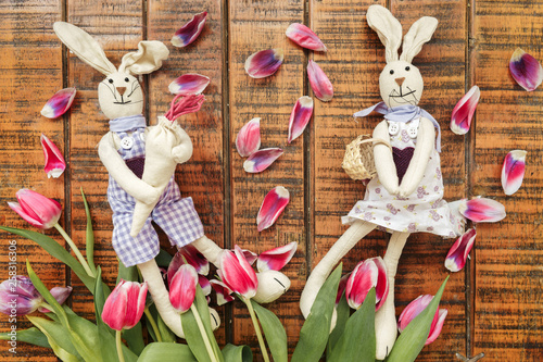 A pair of handmade Easter rabbits made of cloth.