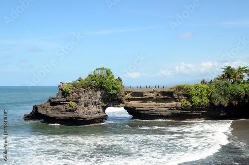 Pura Batu Bolong in the rock in Bali, Indonesia