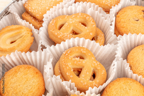 A closeup photo of Danish butter cookies in the traditional tin box photo