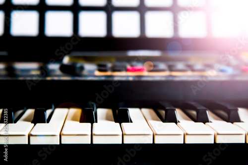keyboard synthesizer piano keys closeup for electronic music production