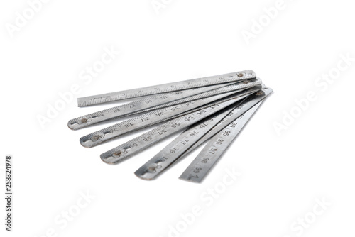 Steel folding ruler isolated on white background.