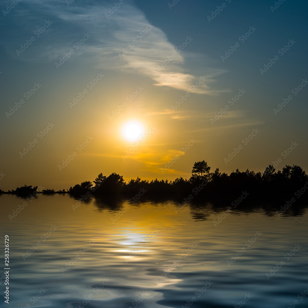 dramatic sunset over the quiet lake