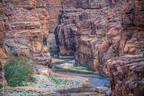 incredibly impressive and beautiful canyon with rocky cliffs in the national park of Jordan Wadi Mujib photo