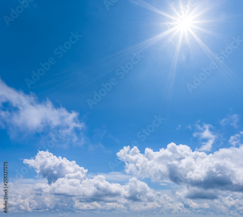 sparkle sun on the blue cloudy sky  natural background