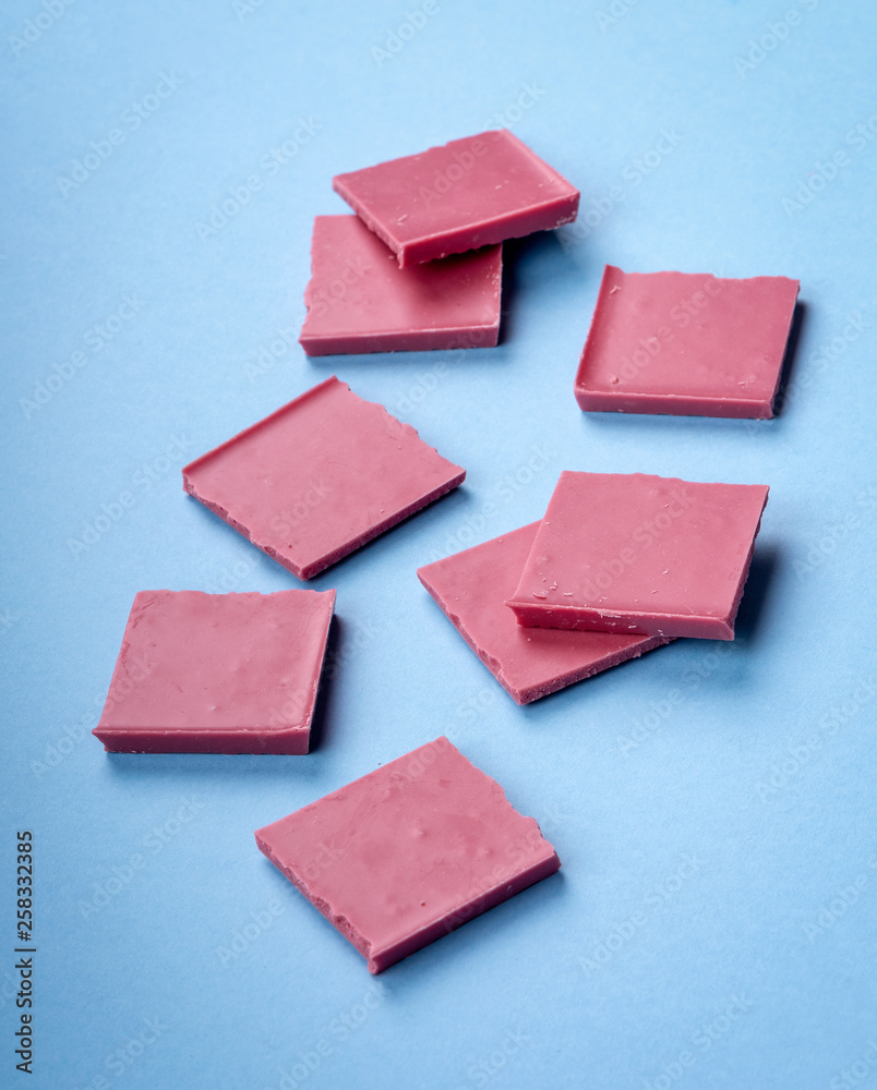 Ruby chocolate on blue background Ruby chocolate on blue background