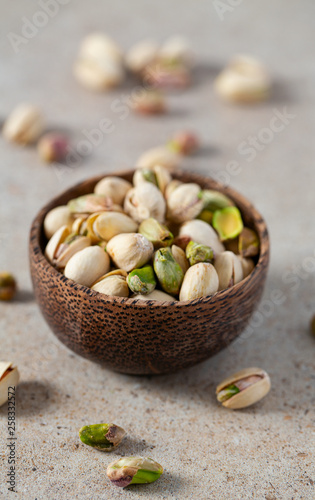 pistachio nuts on granite surface