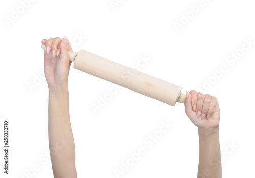 Female hand holding rolling pin