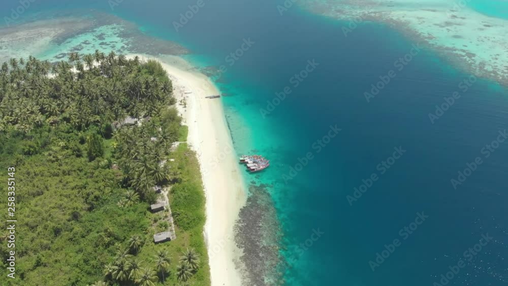 Aerial: flying over coral reef tropical caribbean sea turquoise blue water. Indonesia Sumatra Banyak islands. Top travel tourist destination best diving snorkeling. Native cinelike D-log color profile Aerial: flying over coral reef tropical caribbean sea turquoise blue water. Indonesia Sumatra Banyak islands. Top travel tourist destination best diving snorkeling. Native cinelike D-log color profile