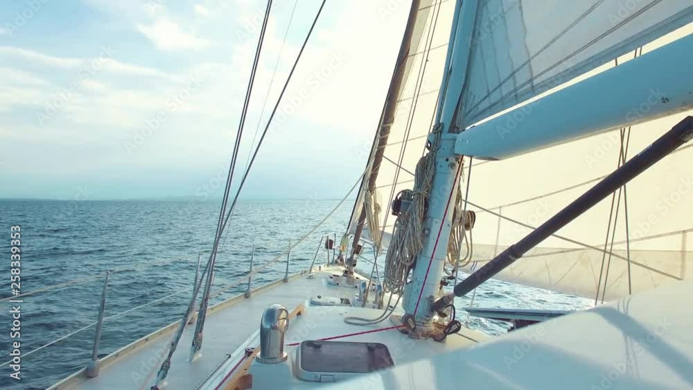 Sail boat ship sailing in the ocean on a sunny summer day Sail boat ship sailing in the ocean on a sunny summer day