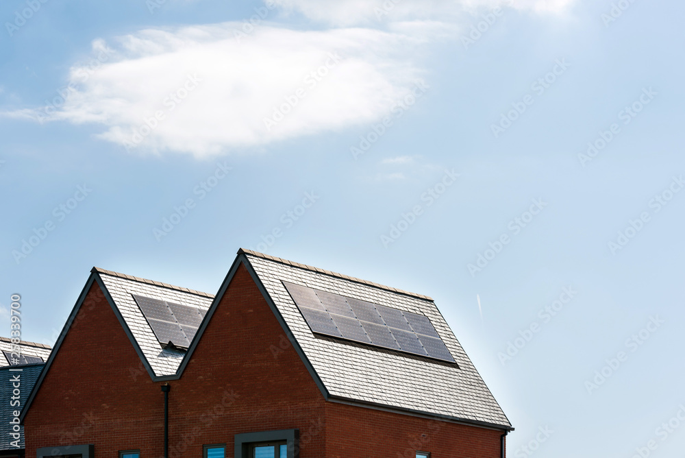 solar panels on roof of new houses in england uk on bright sunny day solar panels on roof of new houses in england uk on bright sunny day