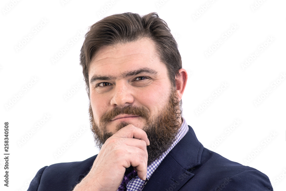 Portrait of a big handsome pensive bearded business man in a dark suit and a bright blue tie, isolated on white Portrait of a big handsome pensive bearded business man in a dark suit and a bright blue tie, isolated on white