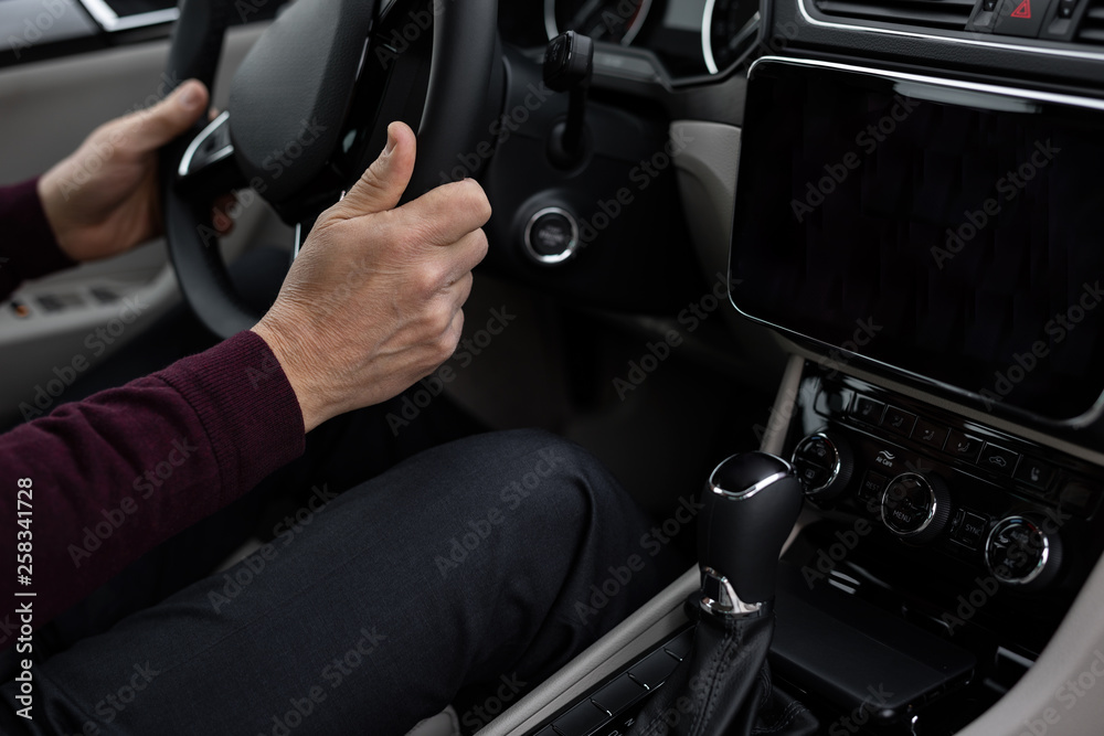 Close up of man using navigation in his car Close up of man using navigation in his car